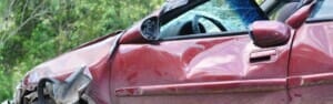 Car with dented side from an accident before calling a Bus Accident Lawyer Tacoma, WA